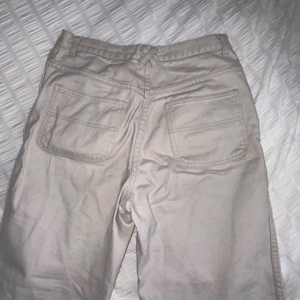 Cream colored high wasted straight leg 90s jeans